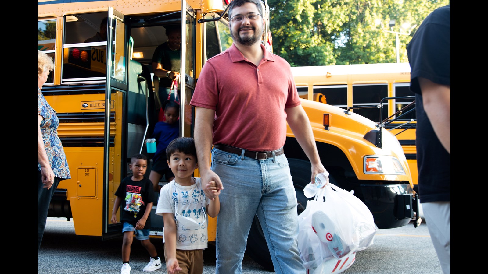 Kindergarten students arrive at Tritt Elementary School following the bus ride along